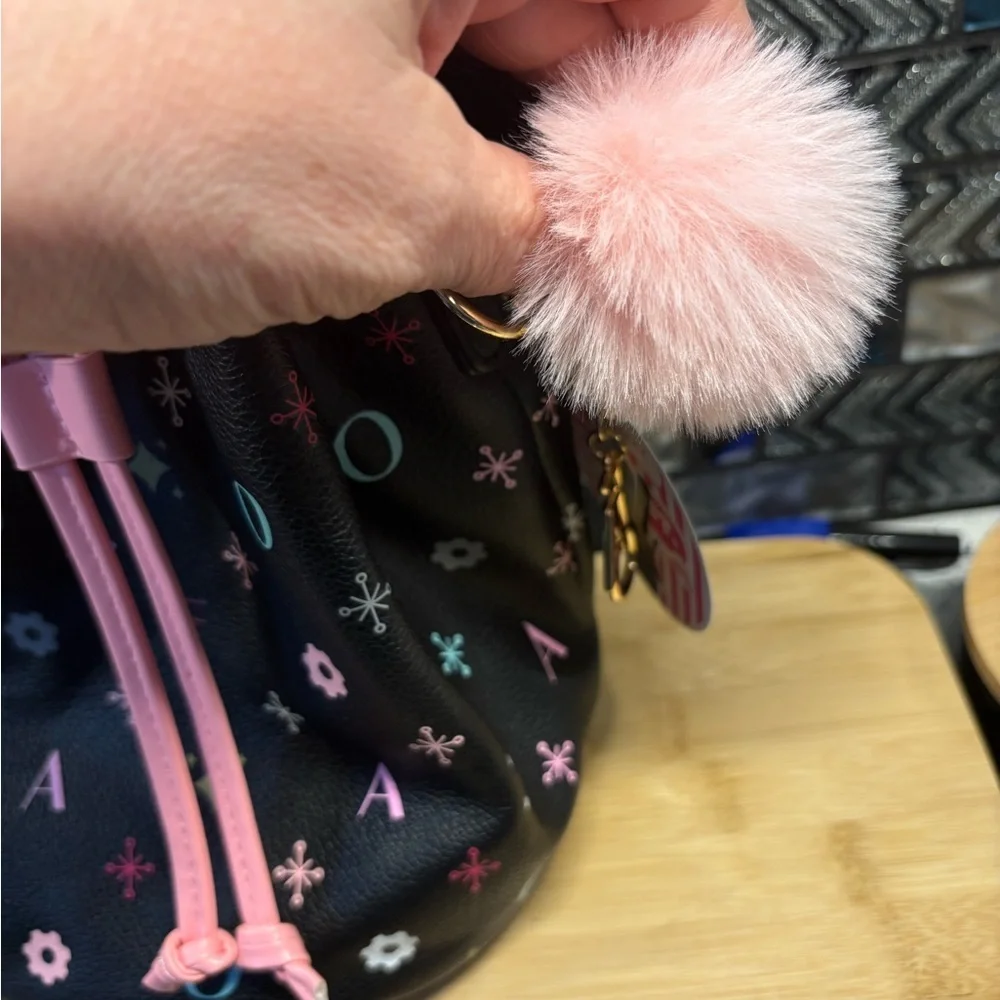 FAO Schwarz Black Drawstring Bucket Bag with Pink Trim and Multicolor Accents